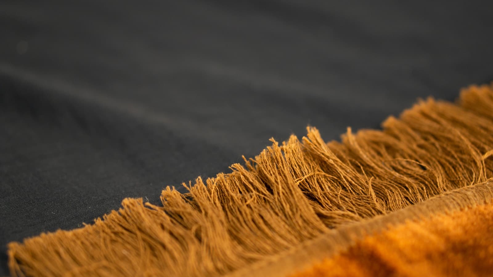 Check the fringes — sewn on or integrated?